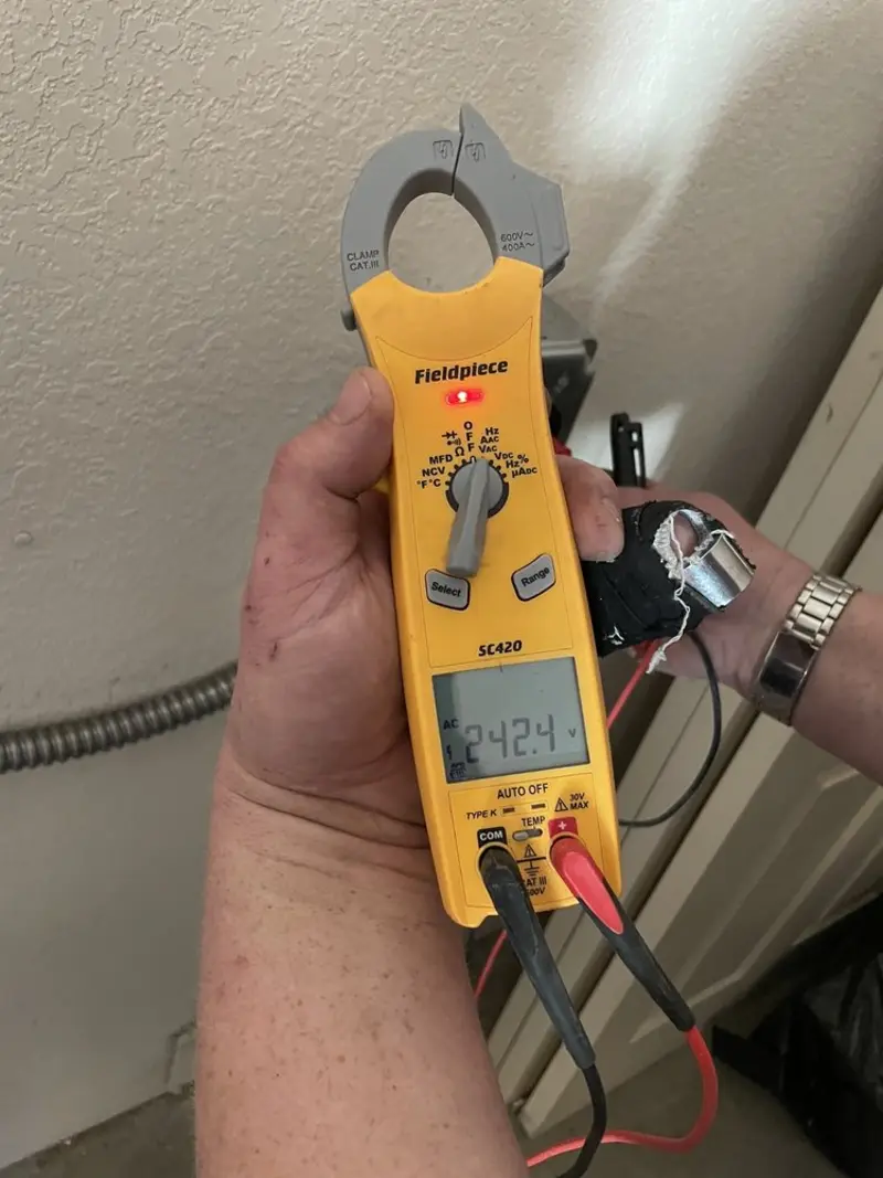 Voltage testing with clamp meter during Generator Installation in Mountain Park